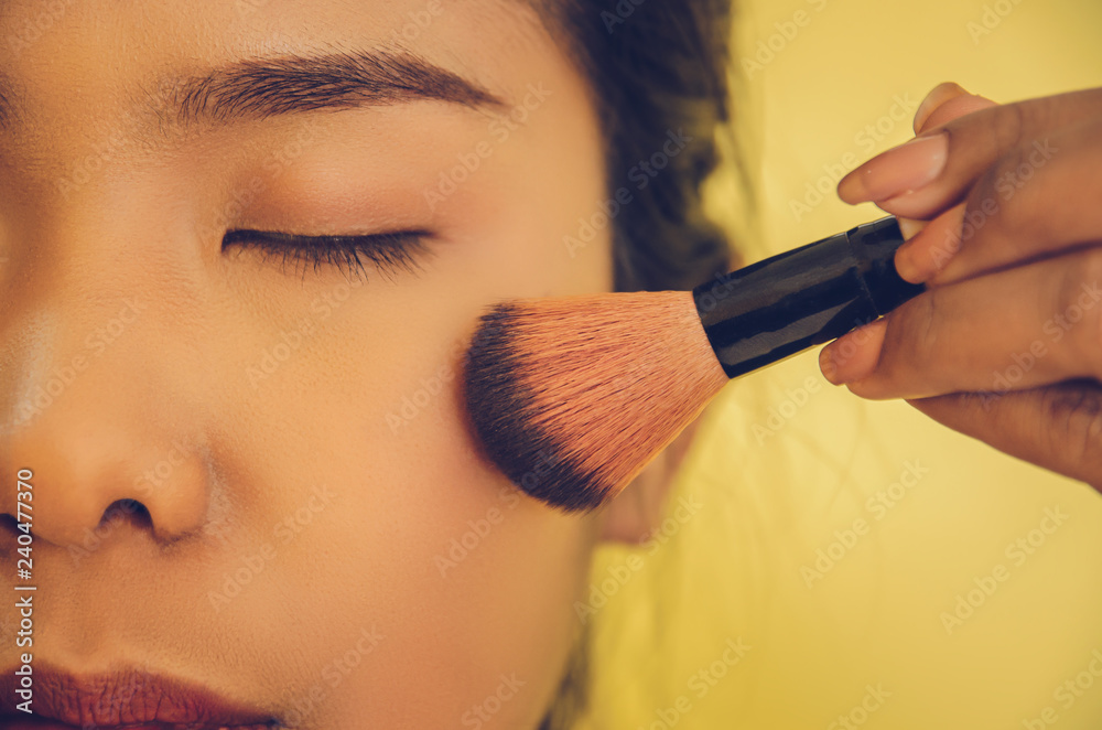 Beauty face of Asian woman by applying brushes and smooth face skin by cosmetics. Beauty face of Asian woman by applying brushes and smooth face skin by cosmetics.