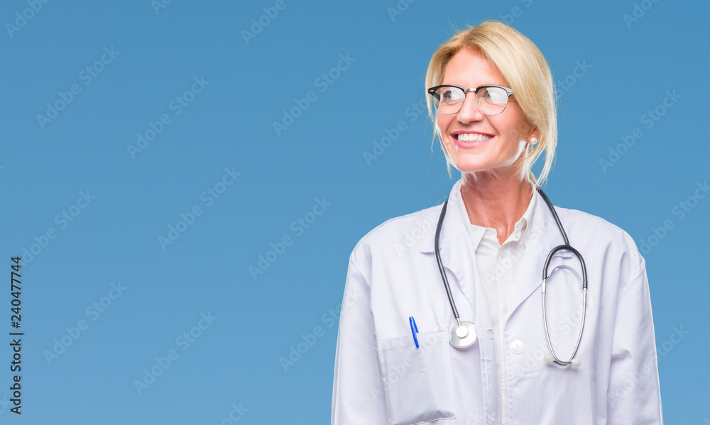 Middle age blonde doctor woman over isolated background smiling looking side and staring away thinking. Middle age blonde doctor woman over isolated background smiling looking side and staring away thinking.