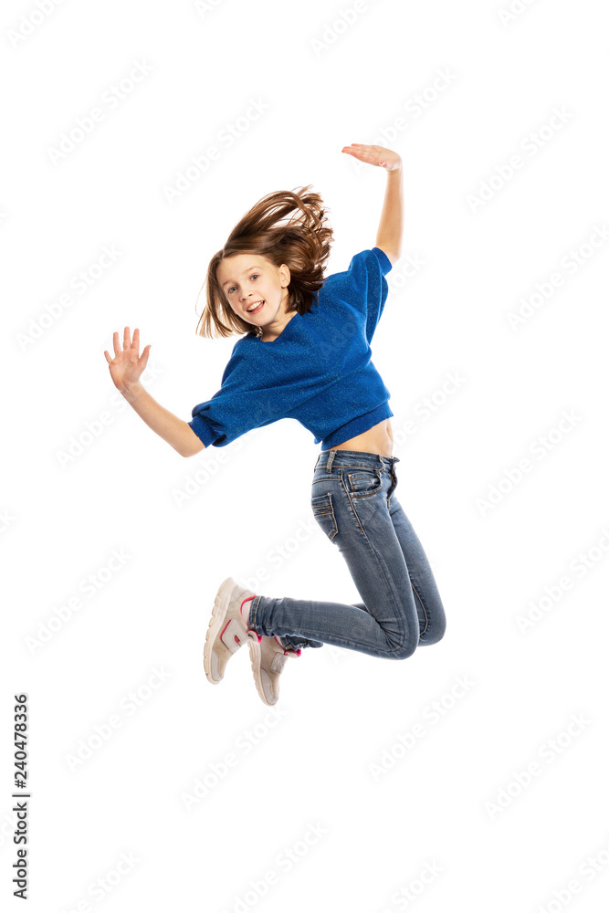 Cute teen girl in high jump, isolated on white background