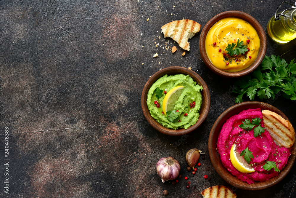 Assortment of hummus.Top view with copy space. Assortment of hummus.Top view with copy space.