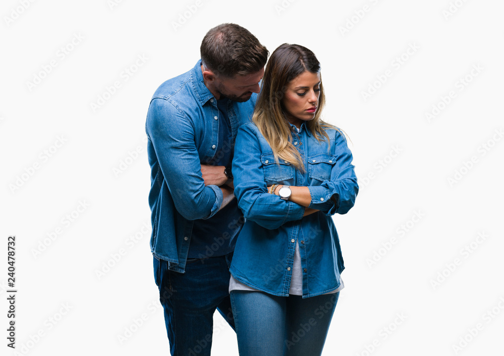 Young couple in love over isolated background skeptic and nervous, disapproving expression on face with crossed arms. Negative person. Young couple in love over isolated background skeptic and nervous, disapproving expression on face with crossed arms. Negative person.