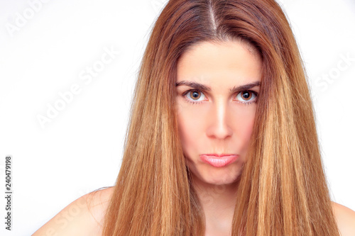 Beautiful woman with open hair makes a pout