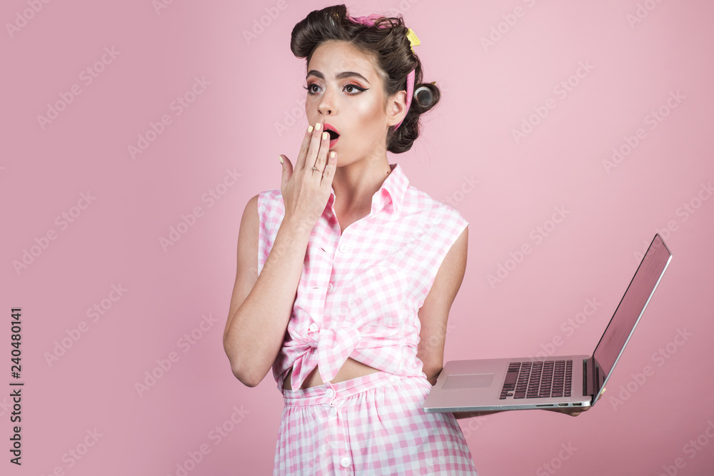 pinup girl with fashion hair. pretty girl in vintage style. retro woman  with moneybox. Housewife. pin up woman with trendy makeup. time to relax.  tired housewife with laptop. remote work. online Stock