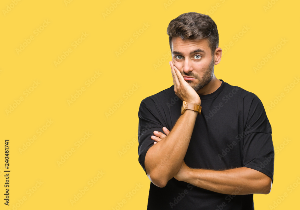 Young handsome man over isolated background thinking looking tired and bored with depression problems with crossed arms. Young handsome man over isolated background thinking looking tired and bored with depression problems with crossed arms.