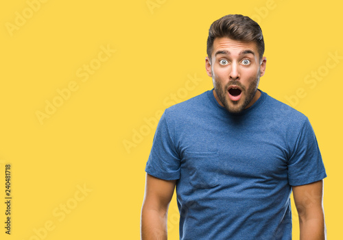 Fotografie Young handsome man over isolated background afraid and shocked with surprise expression, fear and excited face
