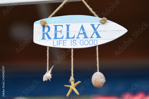 bar on the beach decorated with seashells and inscription relax in a hotel on the territory of Albania, the Adriatic coast.