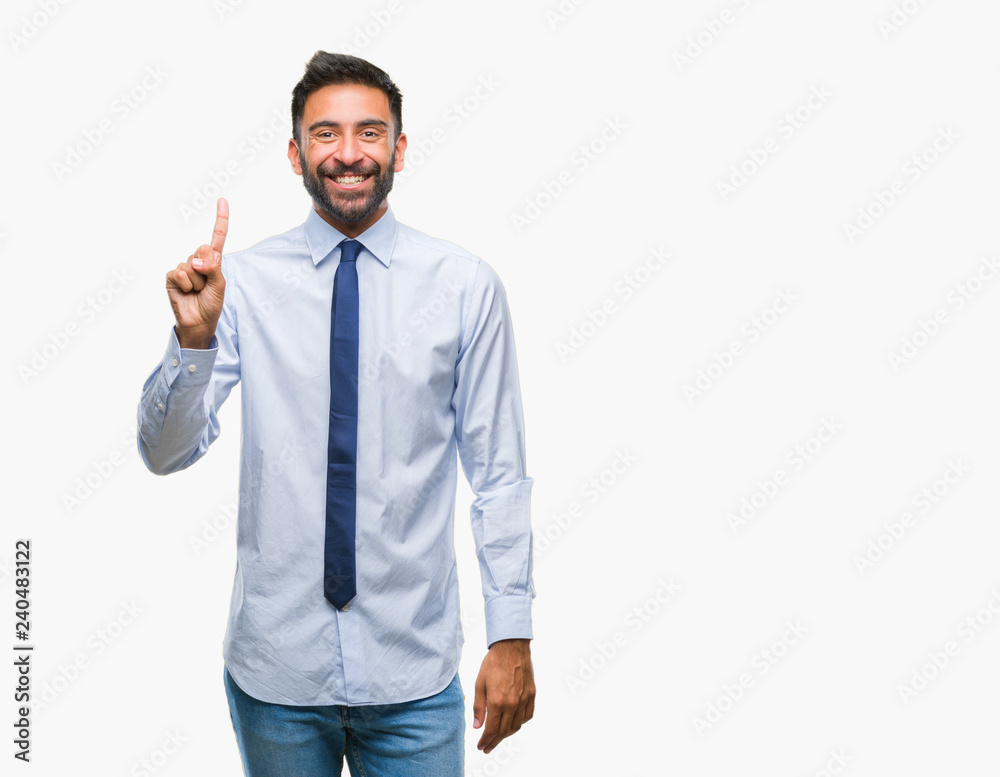 Adult hispanic business man over isolated background showing and pointing up with finger number one while smiling confident and happy. Adult hispanic business man over isolated background showing and pointing up with finger number one while smiling confident and happy.