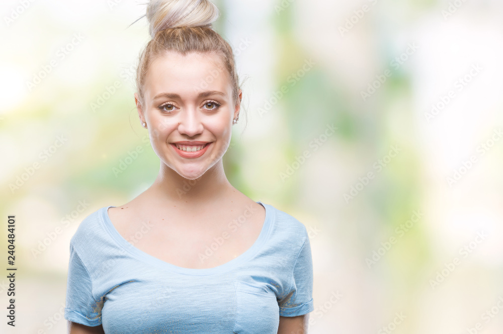 Young blonde woman over isolated background with a happy and cool smile on face. Lucky person. Young blonde woman over isolated background with a happy and cool smile on face. Lucky person.