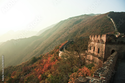 Towers of a great wall at sunset in autumn