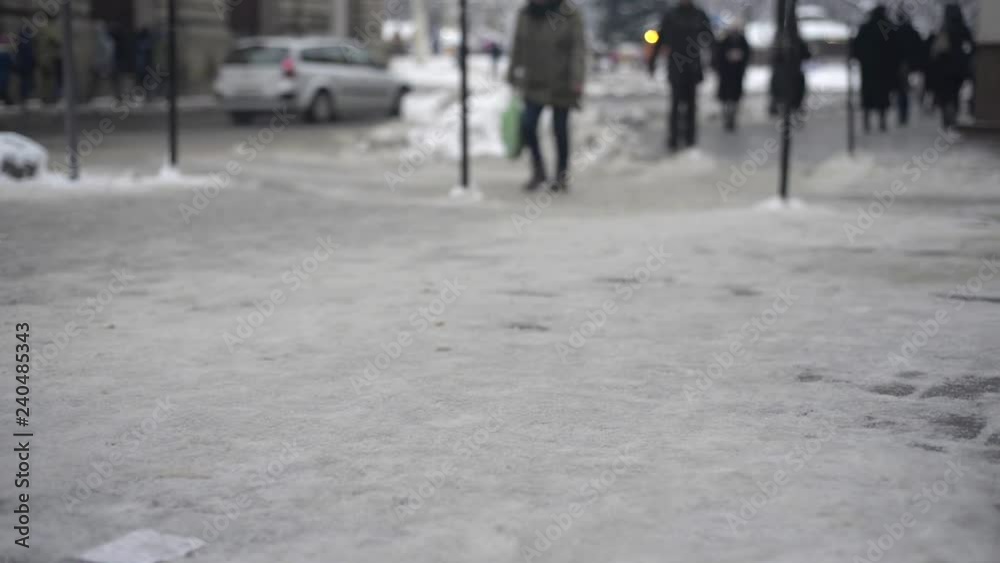 Peoples and cars on street in winter blurred Peoples and cars on street in winter blurred