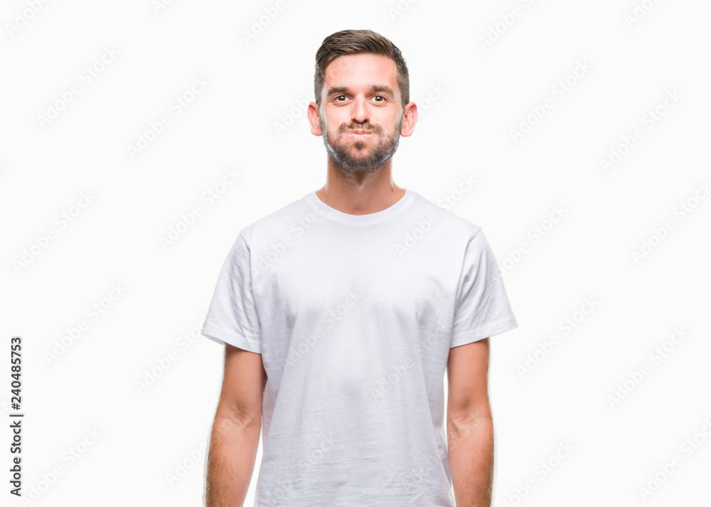 Young handsome man over isolated background puffing cheeks with funny face. Mouth inflated with air, crazy expression.