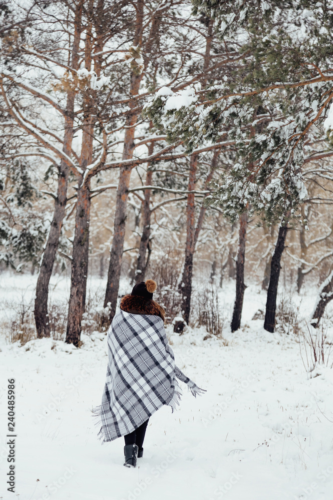 girl in winter in a plaid plaid