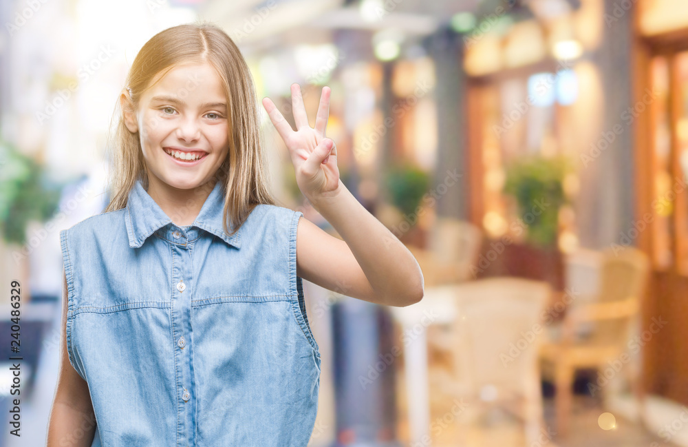 Young beautiful girl over isolated background showing and pointing up with fingers number three while smiling confident and happy.