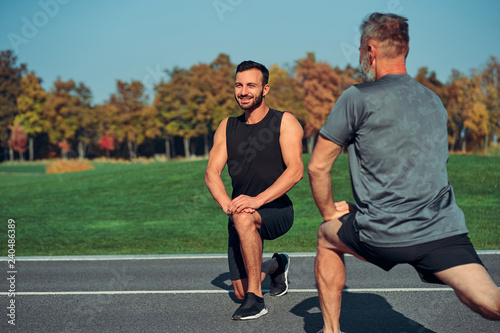 The two men doing exercise outdoor