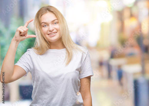 Young caucasian woman over isolated background smiling and confident gesturing with hand doing size sign with fingers while looking and the camera. Measure concept. Free Download Young caucasian woman over isolated background smiling and confident gesturing with hand doing size sign with fingers while looking and the camera. Measure concept. - GFXLoad