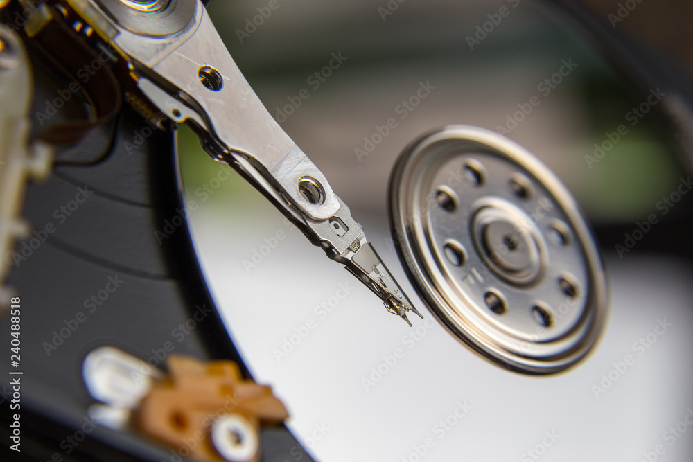 Hard drive from computer or laptop lies on the table in the repair shop. Performs fault diagnostics and performs urgent repairs recovery of lost data during deletion HDD closeup Hard drive from computer or laptop lies on the table in the repair shop. Performs fault diagnostics and performs urgent repairs recovery of lost data during deletion HDD closeup