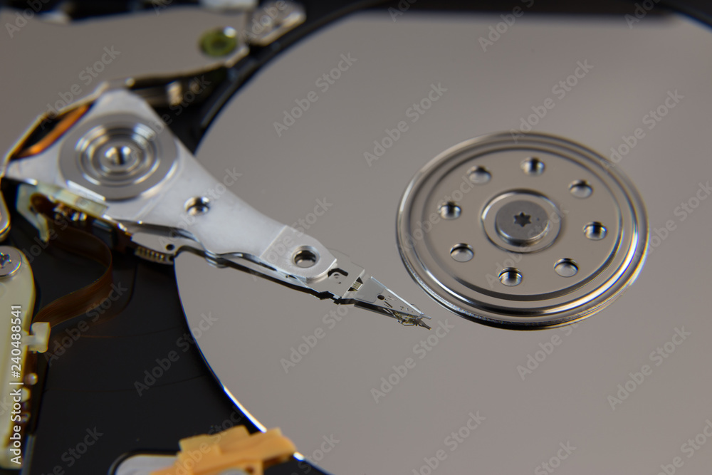 Hard drive from computer or laptop lies on the table in the repair shop. Performs fault diagnostics and performs urgent repairs recovery of lost data during deletion HDD closeup Hard drive from computer or laptop lies on the table in the repair shop. Performs fault diagnostics and performs urgent repairs recovery of lost data during deletion HDD closeup