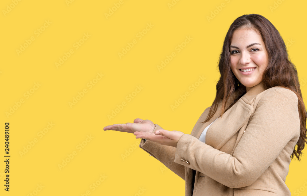 Beautiful plus size young woman wearing winter coat over isolated background Pointing to the side with hand and open palm, presenting ad smiling happy and confident Beautiful plus size young woman wearing winter coat over isolated background Pointing to the side with hand and open palm, presenting ad smiling happy and confident