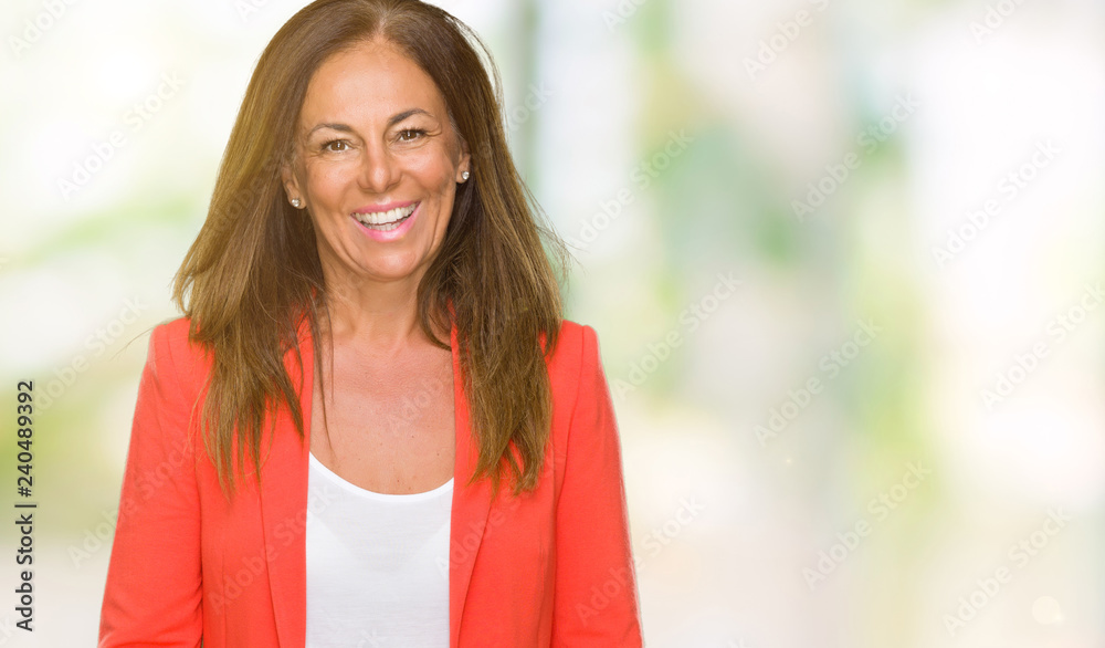 Beautiful middle age business adult woman over isolated background with a happy and cool smile on face. Lucky person. Beautiful middle age business adult woman over isolated background with a happy and cool smile on face. Lucky person.