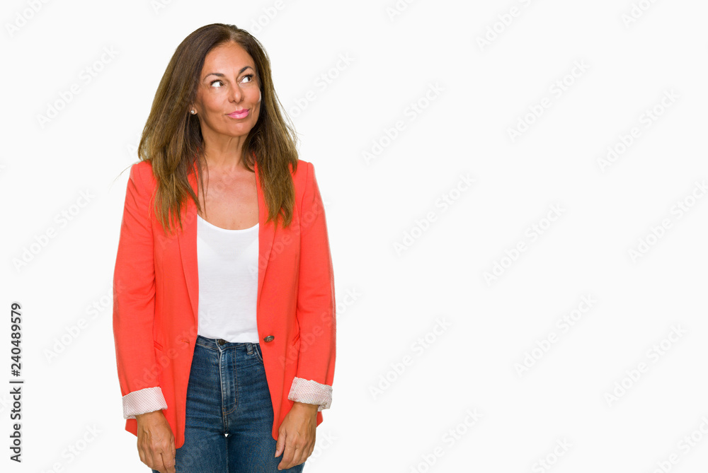 Beautiful middle age business adult woman over isolated background smiling looking side and staring away thinking. Beautiful middle age business adult woman over isolated background smiling looking side and staring away thinking.