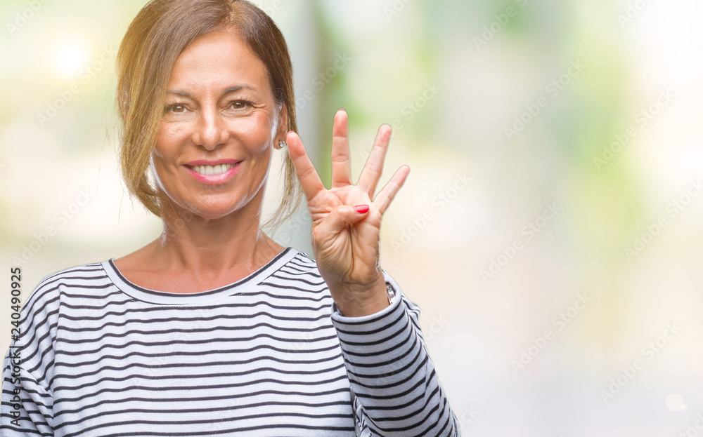Middle age senior hispanic woman over isolated background showing and pointing up with fingers number four while smiling confident and happy. Middle age senior hispanic woman over isolated background showing and pointing up with fingers number four while smiling confident and happy.