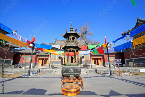 Copper incense burner in a temple photo