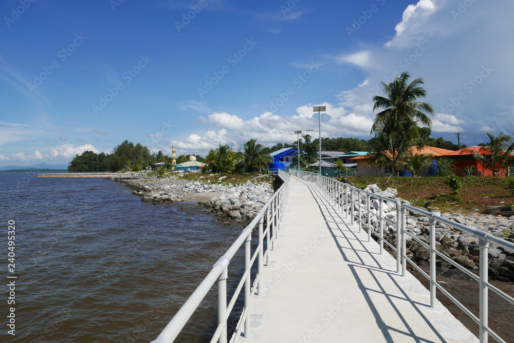 Obraz premium Small village nearby the sea with jetty. Lawas Sarawak Malaysia