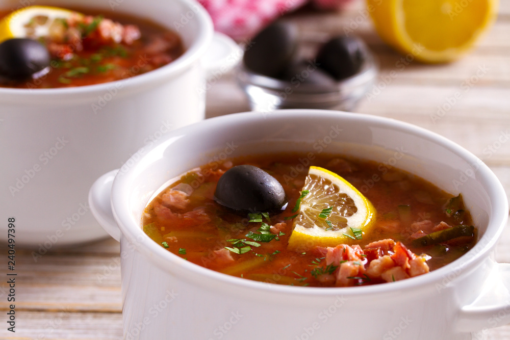 Russian dish solyanka - thick, spicy and sour saltwort soup. horizontal Russian dish solyanka - thick, spicy and sour saltwort soup. horizontal