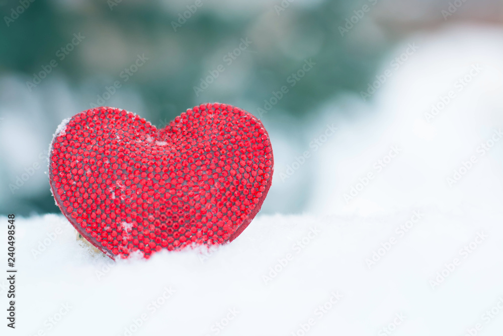 Valentines Day love heart in winter in the snow from above