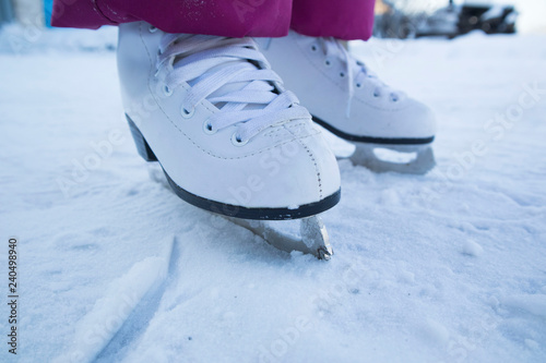 Figure skating. Children white skating on ice. Children's winter sports. Outdoor activities in winter.