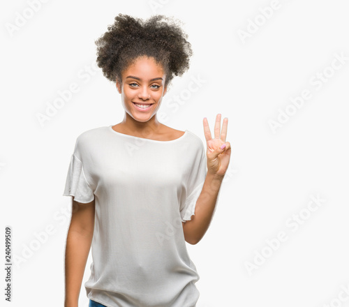 Young afro american woman over isolated background showing and pointing up with fingers number three while smiling confident and happy.