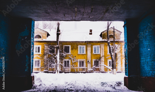 Winter in Eastern Europe. Old houses and snow drifts © konoplizkaya