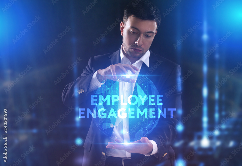 The concept of business, technology, the Internet and the network. A young entrepreneur working on a virtual screen of the future and sees the inscription: Employee engagement The concept of business, technology, the Internet and the network. A young entrepreneur working on a virtual screen of the future and sees the inscription: Employee engagement