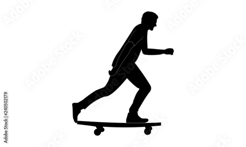  silhouette image of a man riding a skateboard looking sideways.