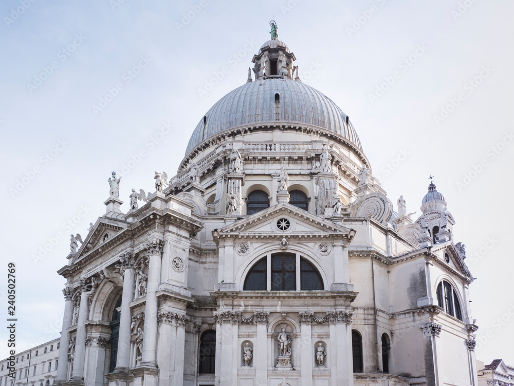 VENICE, ITALY, NOV 1st 2018: Santa Maria della Salute Church or Basilica facade or exterior view. Perspective exterior side view from ground Baroque venetian or italian architecture.
