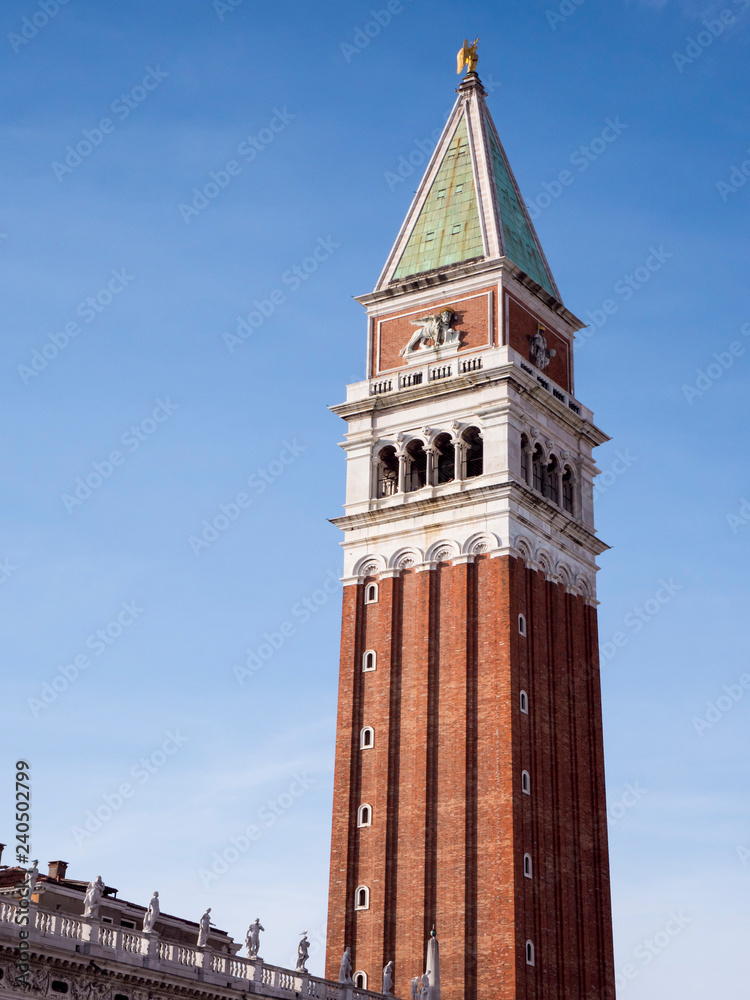 VENICE, ITALY, NOV 1st 2018: Saint Mark's or San Marco Square or Piazza and Bell or observation tower. Beautiful perspective vertical view. Day, Summer.
