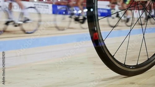 Men ride a bicycle, cycling. Cycling track Pursuit competition sequence.