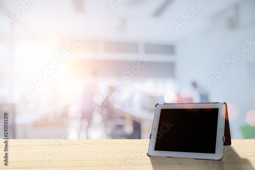 Foto Businessmen blur in the workplace or work space of laptop on table in office room with computer or shallow depth of focus of abstract background