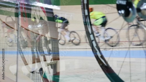 Men ride a bicycle, cycling. Cycling track Pursuit competition sequence.