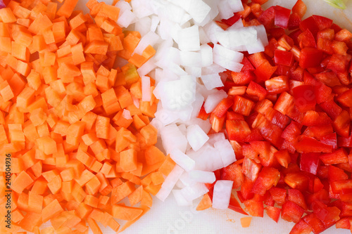 Onion carrots pepper red cut chopped cooking preparation close up
