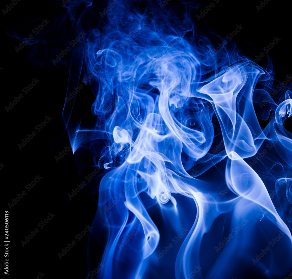 Fototapeta premium Blue smoke on black background