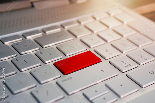 Bild auf Leinwand Keyboard with red blank Enter button modern pc text communication board, Color button on the gray silver keyboard of modern ultrabook