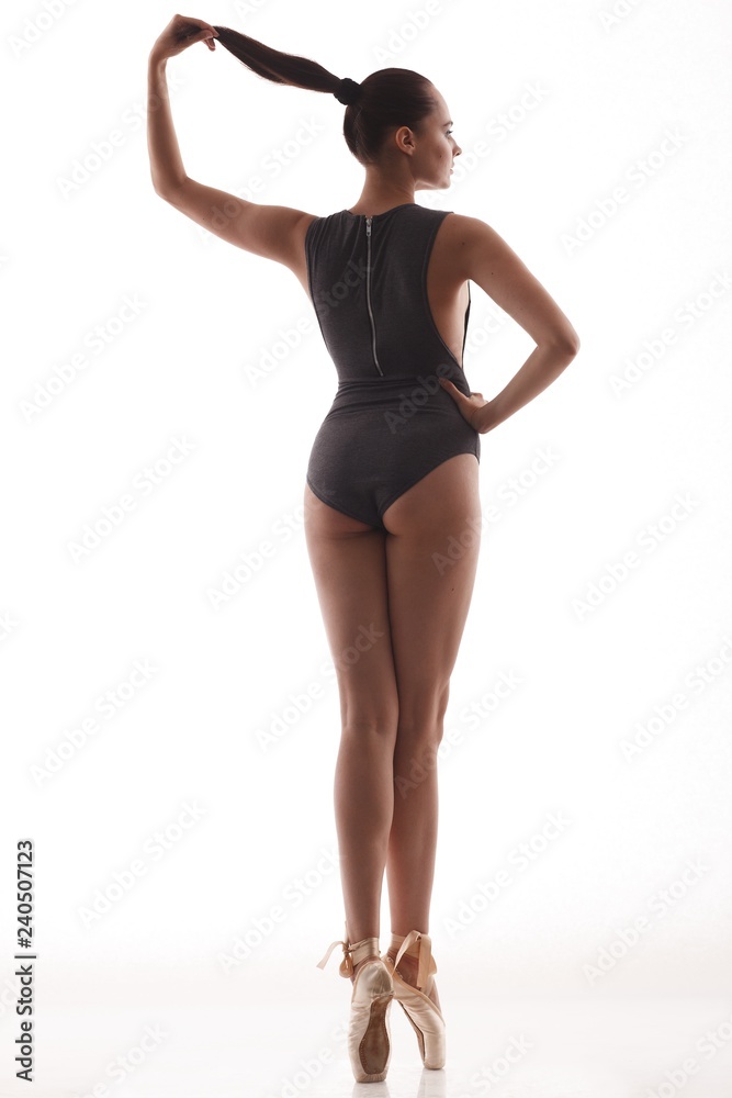 Young and incredibly beautiful ballerina is posing and dancing Young and incredibly beautiful ballerina is posing and dancing
