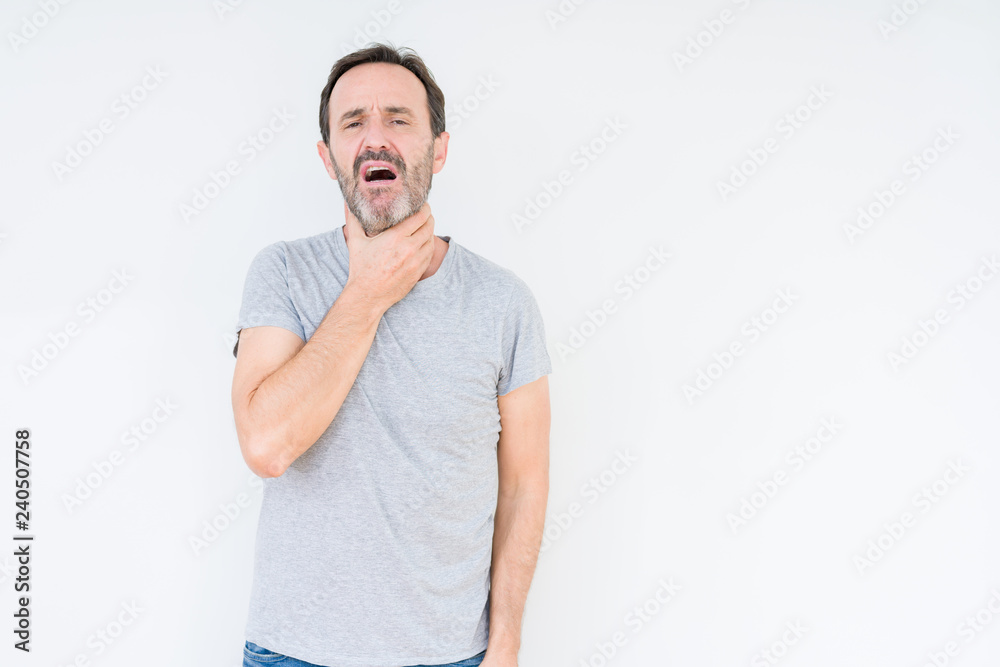 Handsome senior man over isolated background Touching painful neck, sore throat for flu, clod and infection Handsome senior man over isolated background Touching painful neck, sore throat for flu, clod and infection