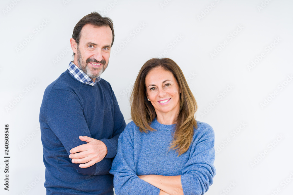 Beautiful middle age couple in love over isolated background happy face smiling with crossed arms looking at the camera. Positive person. Beautiful middle age couple in love over isolated background happy face smiling with crossed arms looking at the camera. Positive person.
