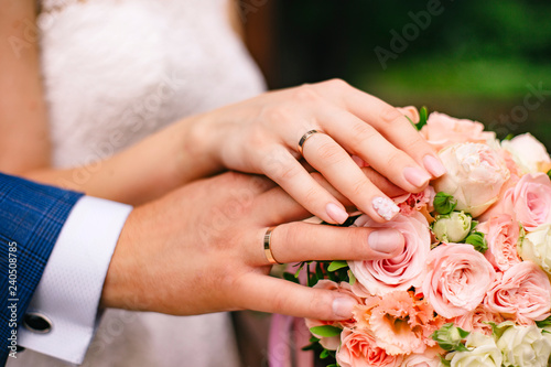 bride and groom holding hands