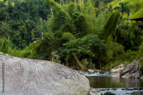 Ancient carved figures on stones in Jayuya Puerto Rico photo