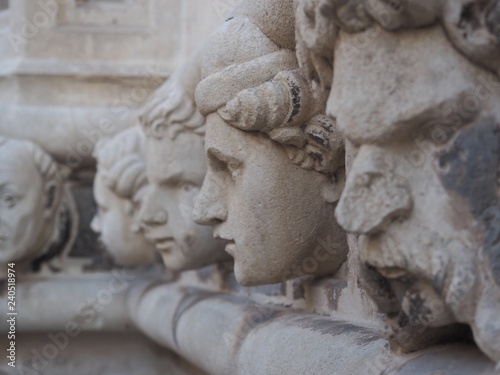 Carved stone faces