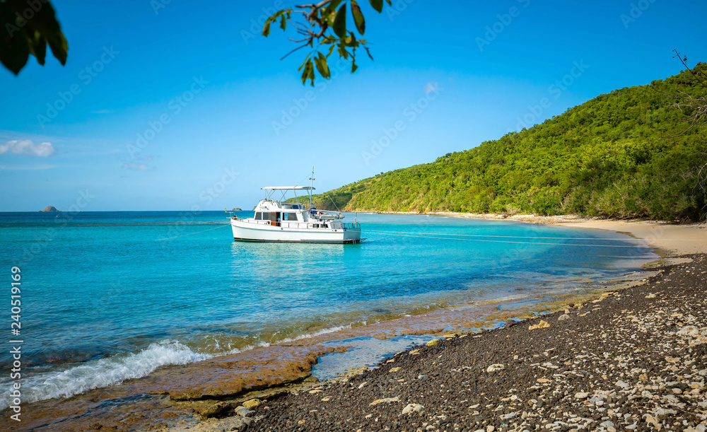 Fototapeta premium Private boat at seashore carribean vacation getaway