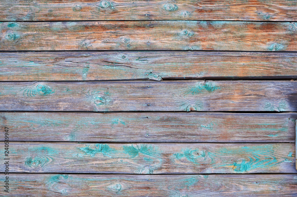 Old wooden painted green shield with cracks and scratches. Old wooden painted green shield with cracks and scratches.